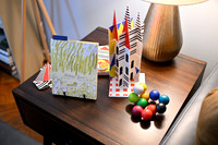 A living room side table with decorations on it